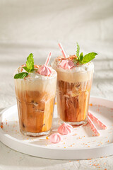 Homemade and fresh ice coffee with sprinkles and whipped cream.
