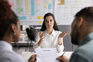 Hispanic female job seeker answering questions about education, skills and knowledge during...
