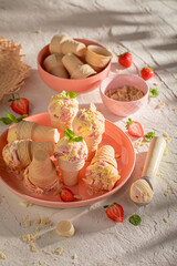 Fresh and tasty strawberry ice cream with fruit and cream.