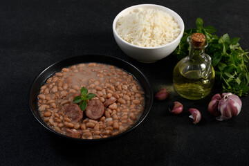 Brazilian beans with sausage and rice, side dishes and presentation