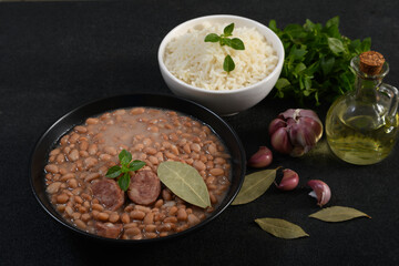 Brazilian beans with sausage and rice, side dishes and presentation