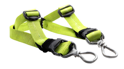 Close up shot of a neon yellow harness with black plastic buckles and silver metal clips on a black background