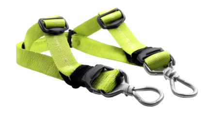 Close up shot of a neon yellow harness with black plastic buckles and silver metal clips on a black background