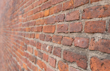 Red brick wall texture background with weathered bricks
