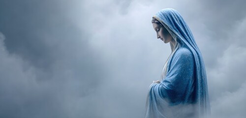 Mother Mary with blue veil and sky background
