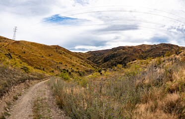 Central otago new zealand rural scene landscape hills mountains wide vista scenic beautiful