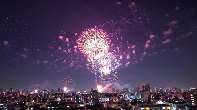 vibrant fireworks display illuminating the night sky in lively urban district