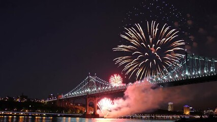 spectacular fireworks display illuminating the night sky above bridge during festival
