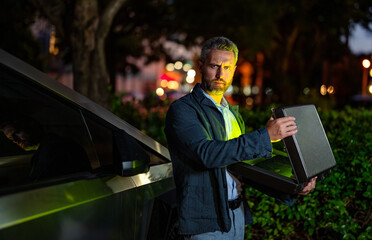 Successful business man at the parking. Success and confidence. Successful businessman with...