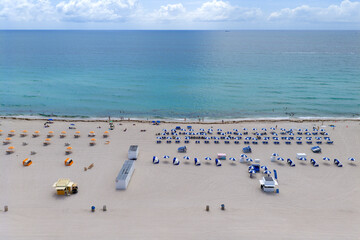 Drone aerial view of Miamis sandy beach. Miami coastline. Wide drone shot of Miami Beach and ocean...