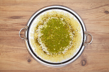 Traditional kunefe dessert with melted cheese and syrup – Turkish sweet pastry kunefe close-up
