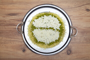 Traditional kunefe dessert with melted cheese and syrup – Turkish sweet pastry kunefe close-up