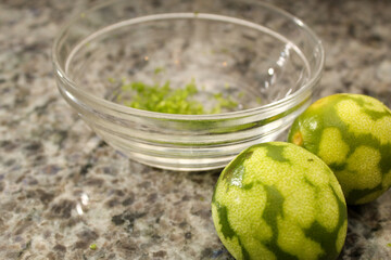 Two Zested Limes with Bowl
