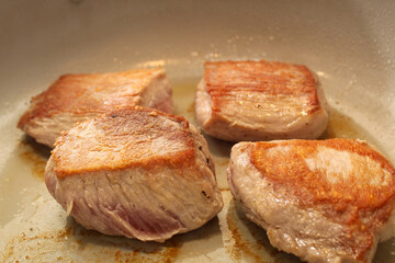 Pork Filets Searing in a Pan with Oil