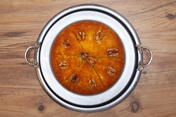 Traditional kunefe dessert with melted cheese and syrup – Turkish sweet pastry kunefe close-up