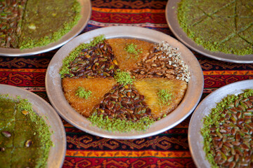 Traditional kunefe dessert with melted cheese and syrup – Turkish sweet pastry kunefe close-up