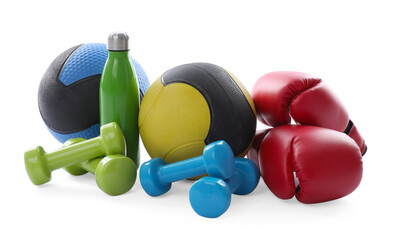 Medicine balls, dumbbells, boxing gloves and water bottle isolated on white
