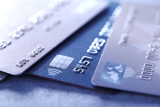 Many different credit cards on table, closeup