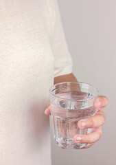 A glass of water in hand