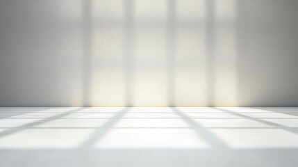 Empty room with white floor and wall illuminated by soft natural light casting grid-like shadows