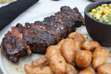 Upscale dining in downtown Columbus featuring gourmet steak dishes, roasted potatoes, and artisan cocktails. A sophisticated culinary experience highlighting modern American cuisine and vibrant platin