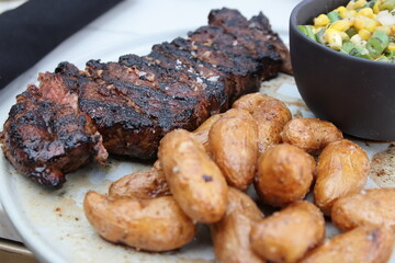 Upscale dining in downtown Columbus featuring gourmet steak dishes, roasted potatoes, and artisan cocktails. A sophisticated culinary experience highlighting modern American cuisine and vibrant platin