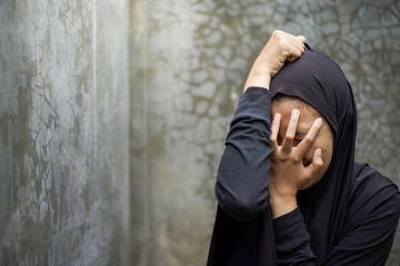 Frustrated sad woman, crop body view young caucasian muslim girl in hijab sitting floor frustrated...