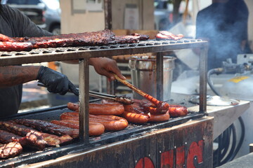 Lively summer scenes from a ribfest celebration featuring sizzling barbecue, smoked meats, and food vendor culture. A feast of flavor, fire, and community under warm seasonal skies in Columbus, Ohio.