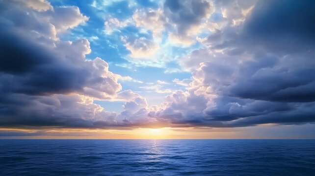 Dramatic storm clouds over calm ocean with vibrant sunset and blue sky, peaceful atmosphere
