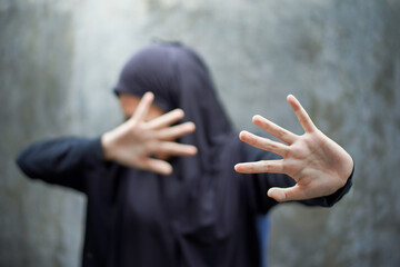 Frustrated sad woman, crop body view young caucasian muslim girl in hijab sitting floor frustrated...