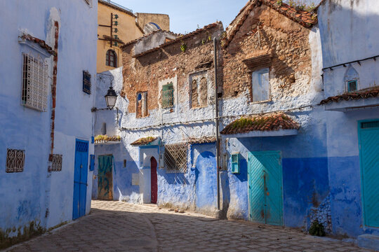 Sunlight Spills into Open Stone Courtyard in the Vibrant Blue Streets of Chefchaouen Morocco