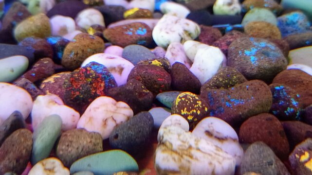 Colorful river rocks glowing under light