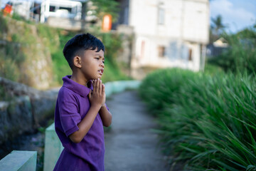 son doing physical workout and warming up before jogging. outdoor sport