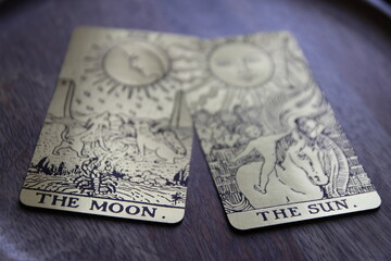 Mystical atmosphere captured through a detailed tarot card arrangement on a textured surface. Rich symbolism and traditional esoteric themes evoke intuition, divination, and spiritual insight. Ideal f