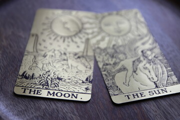 Mystical atmosphere captured through a detailed tarot card arrangement on a textured surface. Rich symbolism and traditional esoteric themes evoke intuition, divination, and spiritual insight. Ideal f