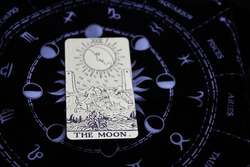 Mystical atmosphere captured through a detailed tarot card arrangement on a textured surface. Rich symbolism and traditional esoteric themes evoke intuition, divination, and spiritual insight. Ideal f