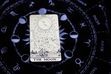 Mystical atmosphere captured through a detailed tarot card arrangement on a textured surface. Rich symbolism and traditional esoteric themes evoke intuition, divination, and spiritual insight. Ideal f