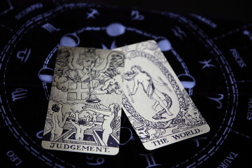 Mystical atmosphere captured through a detailed tarot card arrangement on a textured surface. Rich symbolism and traditional esoteric themes evoke intuition, divination, and spiritual insight. Ideal f