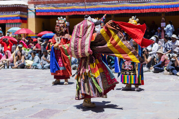 Masked dancers in elaborate costumes perform sacred Cham rituals during the Hemis Festival in...