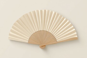 Beige paper fan, closed, on plain background
