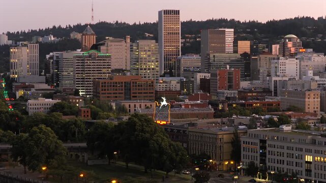 Portland Oregon - Portland City Sign in Front of Downtown Skyline at Dusk 