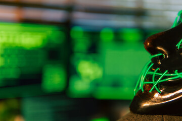 In a dimly lit cyber lair, a glowing hacker mask watches over a desk as encrypted code streams...