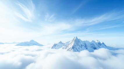 Majestic Snow-Capped Mountains Rising Above Clouds in Breathtaking Blue Sky