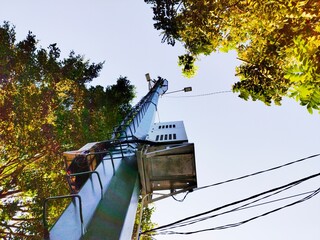 spot light pole with attached box and cables