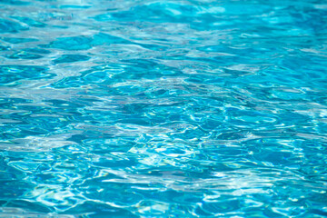Pool water background, blue wave abstract or rippled water texture background.