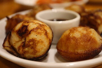 Close-Up of Soft South Indian Kuzhi Paniyaram Served with Sweet Chocolate Sauce – Unique Fusion...