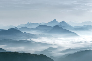 Layers of Mountains in a Colorful Sunrise Mist