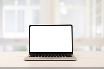 close up isolated on blank white screen display of laptop computer on table inside office room for add content of design banner , website or template or online shopping e-commerce concept