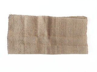 Burlap napkin, old burlap fabric napkin on rustic table background with clipping path. Brown burlap texture close up.