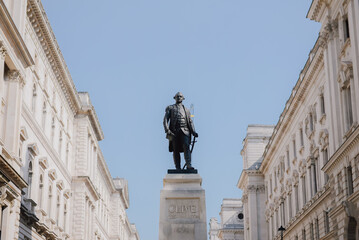 Walking towards the statue of Robert Clive in Whitehall, London, UK. Clive was the first British Governor of the Bengal Presidency.